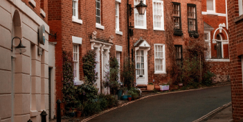 The road next to apartment buildings.
