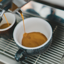 Coffee being poured in a mug
